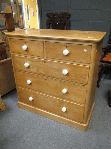 Lot 729 - A Victorian stripped pine chest of drawers,...