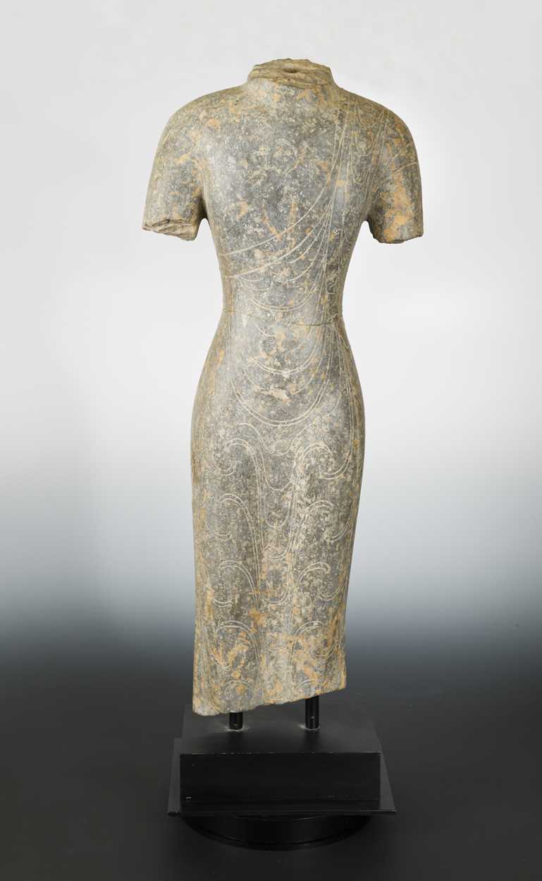 Lot 161 - A Chinese grey limestone torso of a Buddha,