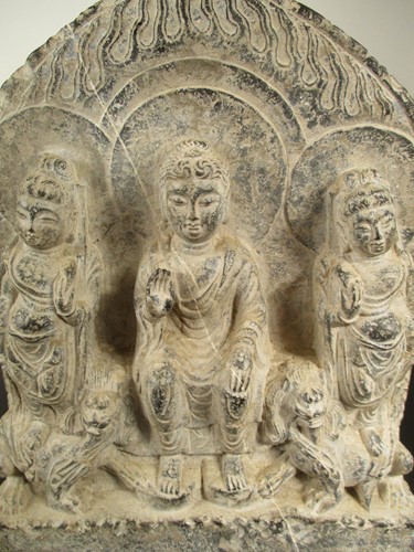 Lot 220 - A Chinese limestone Buddha triad group stele, in Northern Wei Dynasty style