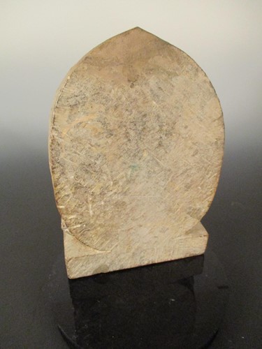 Lot 243 - A Chinese grey stone Buddhist triad stele with aureole, in Wei Dynasty style