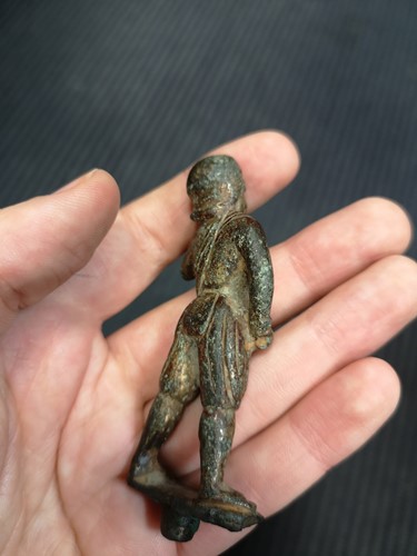 Lot 298 - A Chinese gilt bronze figure of a helmeted man, possibly 10th century