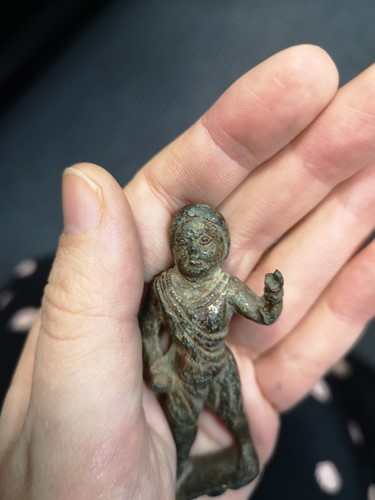Lot 298 - A Chinese gilt bronze figure of a helmeted man, possibly 10th century