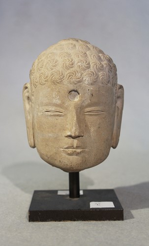 Lot 129 - A Chinese pale cream stone head of Buddha,...