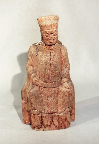 Lot 55 - A Chinese carved wood seated dignitary,...