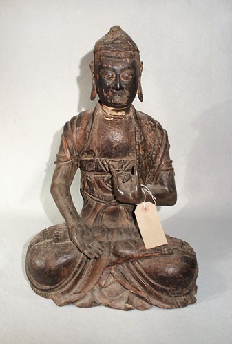 Lot 112 - A Chinese carved wood seated figure of a...