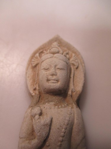 Lot 127 - A Chinese stucco figure of Guanyin standing,...