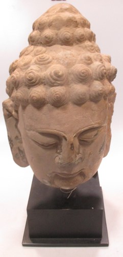 Lot 104 - A cast concrete and painted head of Buddha,...