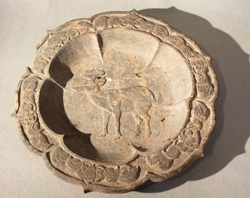 Lot 78 - A Chinese limestone shallow basin carved with...