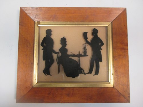 Lot 190 - A silhouette of a family group with a lady...