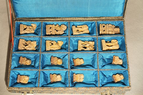 Lot 125 - A Chinese carved soapstone chess set,...