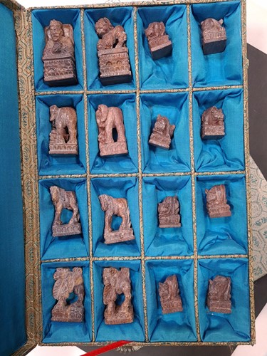 Lot 125 - A Chinese carved soapstone chess set,...