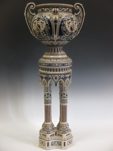 Lot 104 - A German pottery jardiniere and stand, moulded...