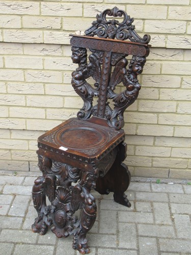 Lot 426 - An Italian carved walnut sgabello hall chair, 19th century