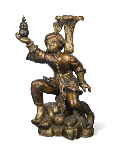Lot 557 - A gilt and gesso carved wood figure of an eastern servant boy