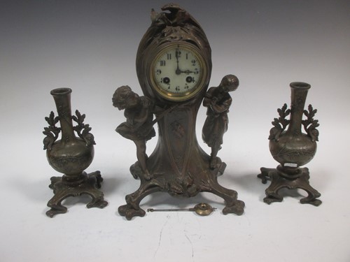 Lot 32 - An Art Nouveau style three piece clock...