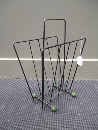 Lot 748 - A 1960/70's wire magazine rack with green ball...