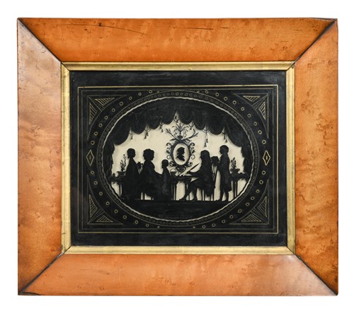 Lot 799 - A Regency reverse glass painted silhouette group of the Burney family