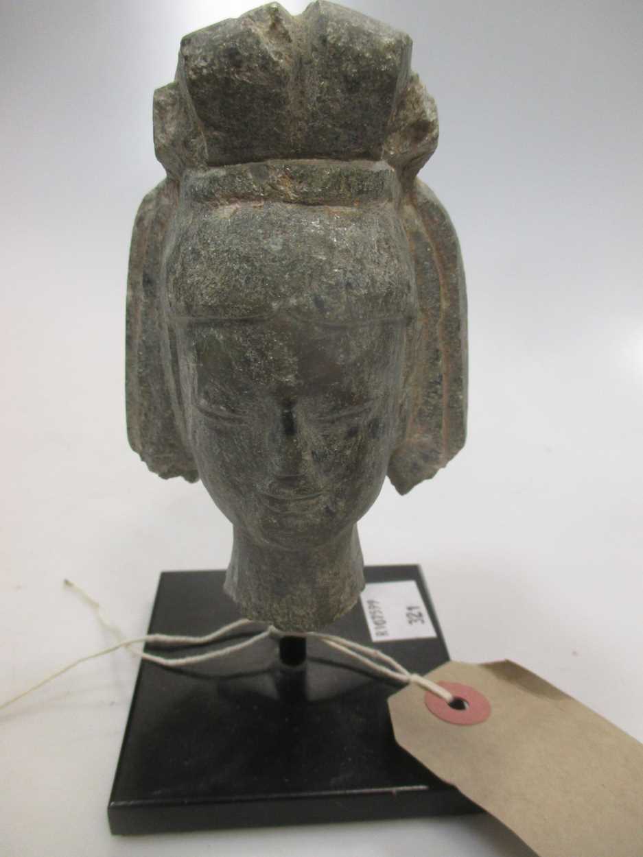 Lot 18 - A grey stone head of a Bodhisattva, 11cm high...