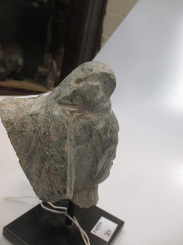 Lot 18 - A grey stone head of a Bodhisattva, 11cm high...