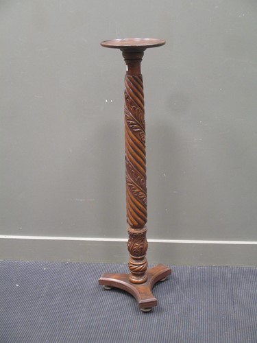 Lot 586 - A mahogany carved torchere stand 123cm high