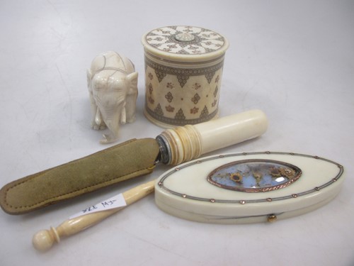 Lot 139 - A small collection of ivory items to include a...