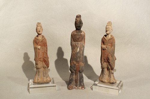 Lot 91 - Three Chinese pottery figures of standing...