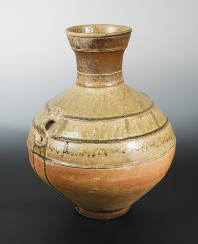 Lot 74 - A Chinese olive glazed pottery vase, hu, mask...