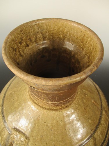 Lot 369 - A Chinese olive glazed pottery vase, hu