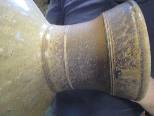 Lot 369 - A Chinese olive glazed pottery vase, hu