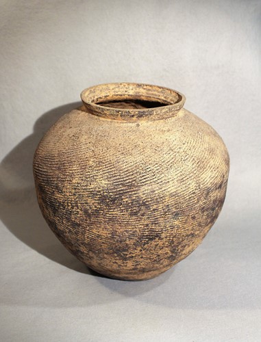 Lot 142 - A Chinese grey-ware pottery large compressed...