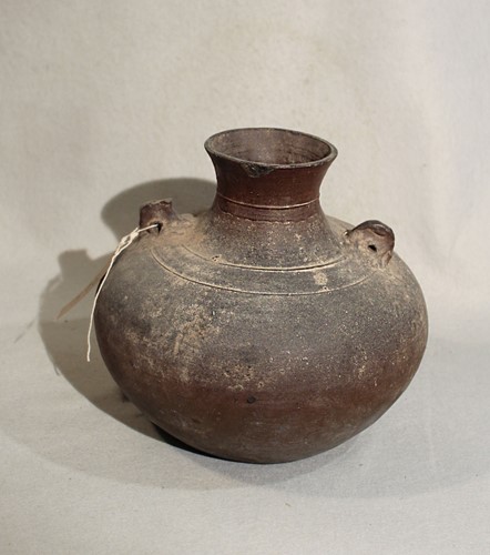 Lot 80 - A Chinese brown glazed pottery vase,...