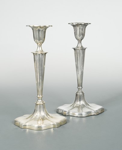 Lot 404 - A pair of George V silver candlesticks