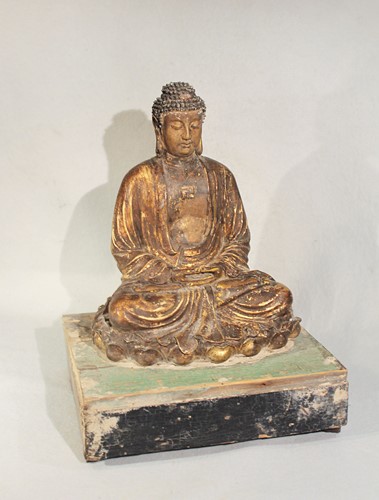 Lot 64 - A Chinese gilded pottery seated Buddha in...