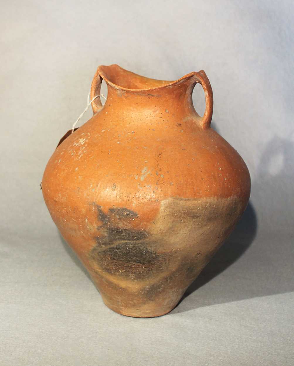 Lot 76 - A Chinese red pottery shouldered vase with...