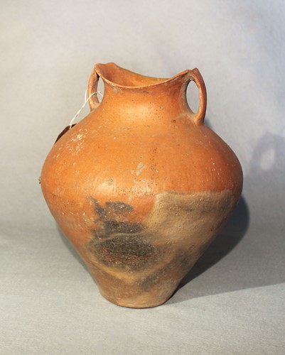 Lot 76 - A Chinese red pottery shouldered vase with...