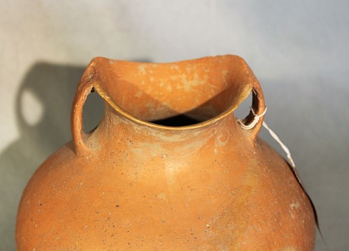 Lot 76 - A Chinese red pottery shouldered vase with...