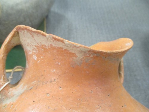 Lot 76 - A Chinese red pottery shouldered vase with...