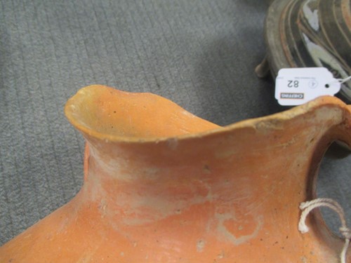 Lot 76 - A Chinese red pottery shouldered vase with...