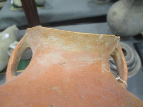 Lot 76 - A Chinese red pottery shouldered vase with...