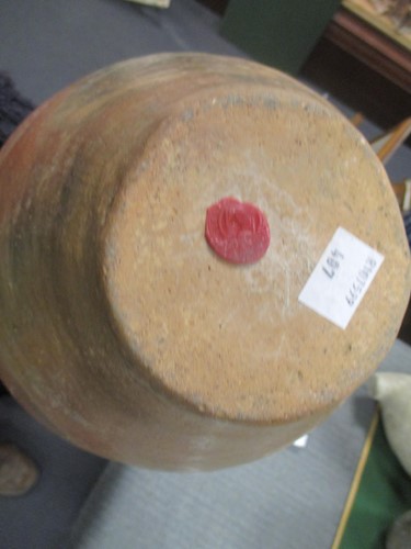 Lot 76 - A Chinese red pottery shouldered vase with...