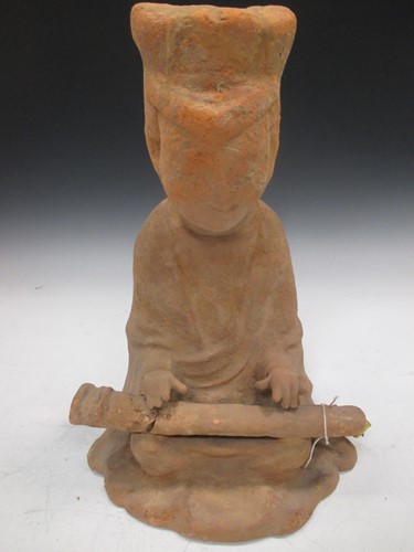 Lot 58 - A Chinese red pottery, Seated musician. Han...