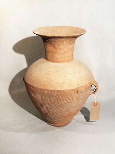 Lot 77 - A Chinese pottery two handled vase, Neolithic,...