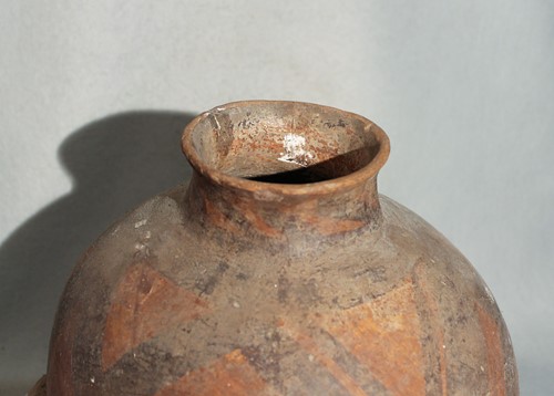 Lot 110 - A Chinese Neolithic painted pottery storage...