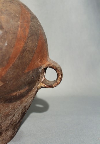 Lot 110 - A Chinese Neolithic painted pottery storage...