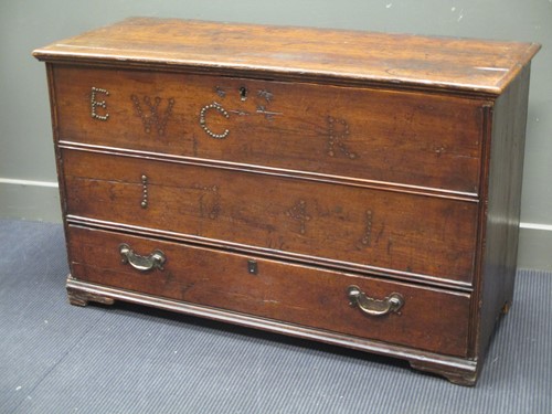 Lot 593 - An 18th century oak mule chest with stud work...