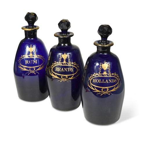 Lot 30 - A set of three Bristol Blue decanters and stoppers