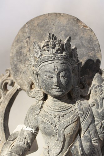 Lot 393 - A carved Grey Stone Tara in 16th century style,  Chinese in Nepalese taste
