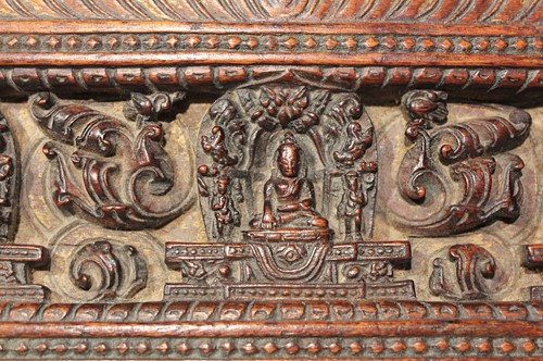 Lot 394 - A Tibetan carved wood manuscript cover, 14th/15th century or later