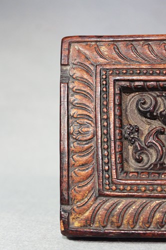 Lot 394 - A Tibetan carved wood manuscript cover, 14th/15th century or later