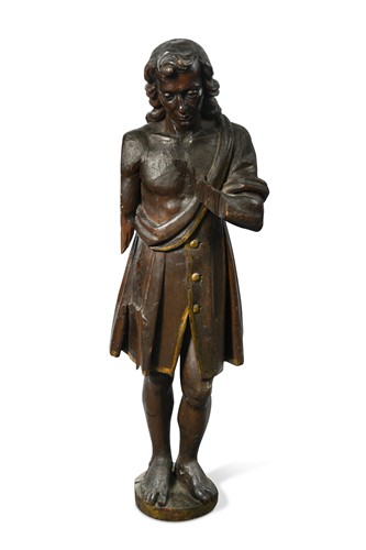 Lot 456 - A carved softwood figure of a man,  possibly 17th century